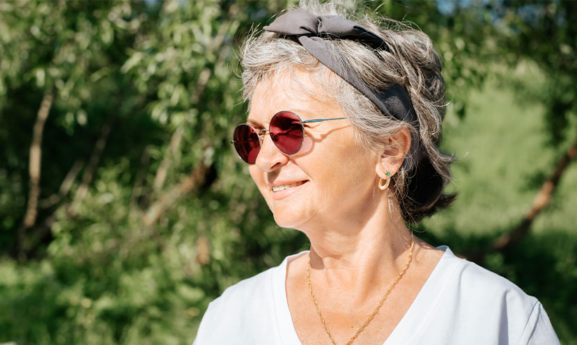Woman with short gray hair wearing a headband